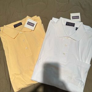 1 yellow and  1 white Roundtree and Yorke polo golf shirts . With pocket. Large